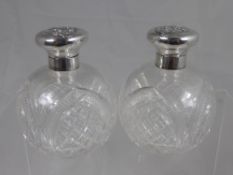 Two Silver Topped Cut Glass Scent Bottles, London hallmark, dated 1907/8 the first with the