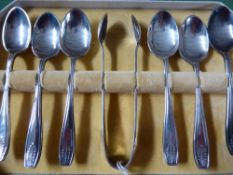A set of six silver plated teaspoons with tongs in the original case.