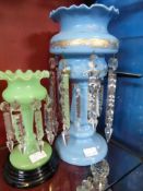 Two Victorian candle lustre`s, the first turquoise with hand painted floral decoration 37 cms high,