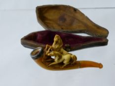 An Antique Meerschaum and Amber Pipe in original presentation case depicting running horses.