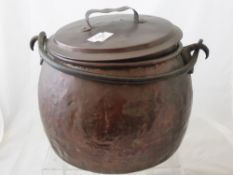 A vintage copper jam pan having a cast iron table, est. diameter 26 cms.