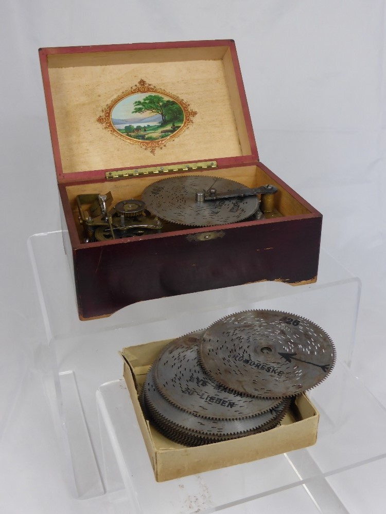 An Antique Music Box, with a quantity of metal records, including II Trovatore Miserere; I`m