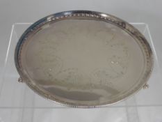 A Garrard & Co Solid Silver Tray, Sheffield hallmark, dated 1978, the tray with beaded edge and a