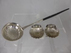 A Pair of White Metal Salts, taking the form of scallops with three dolphin feet together with a