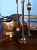 An antique mahogany handled copper warming pan together with a set of copper fire irons and a