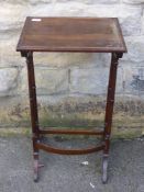 A Victorian rose wood topped occasional table on turned spindle supports, approx. 40 x 32 x 75 cms.