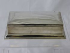 A Gentleman`s Solid Silver Table Top Snuff Box, the snuff box having a step frame base with gilded