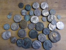 A collection of miscellaneous Roman coins ( in a Hamlet cigar tin )