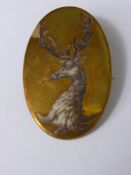 A Gold Metal and Pictorial Enamel Brooch in the form of a stag, 4.3 x 2.7 cms.
