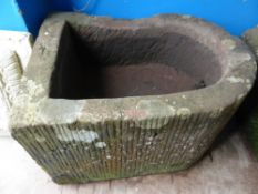 A vintage stone D shaped pump trough, approx. 62 x 51 x 36 cms.