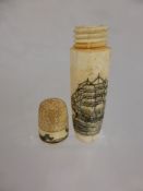 A Scrimshaw needle case depicting a sailing vessel and a sperm whale and the top in the form of a