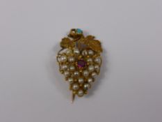 An Antique Gold Ruby and Pearl Brooch, the brooch in the form of a bunch of grapes set with seed