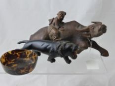 An Antique Chinese Carved Figure of a Man riding a buffalo, the buffalo with glass eyes, 25 x 12