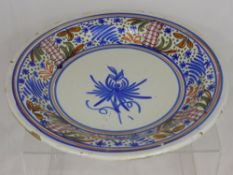 A Continental Majolica Charger, with decorative outer border.