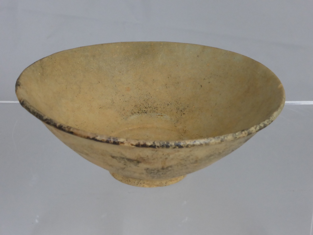 An Antique Chinese Earthenware Bowl, 17 cms diameter.