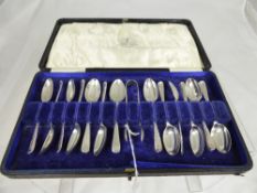 A Solid Silver 12 piece set of teaspoons and sugar nips, in original presentation box (1 odd spoon)