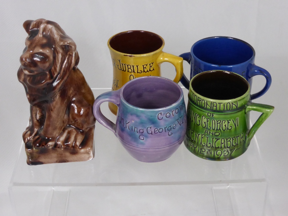 A Brown Glazed Pottery Lion, together with six Commemorative mugs, including a green glaze mug for