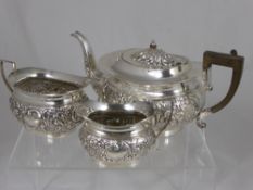 A solid silver Tea Trio, comprising tea pot, sugar bowl and milk jug, Birmingham hallmark 1907, mm