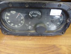 A Vintage Motor Instrument Panel, depicting R.P.M; Coolant; M.P.H and a Fuel Gauge.