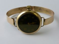 A Gentleman`s 9 ct Gold Bespoke Pocket Watch Style Vintage Wrist Watch, the watch having a black