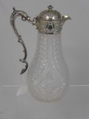 A Cut Crystal and Silver Claret Jug, with solid silver hinged lid, with decorative collar and