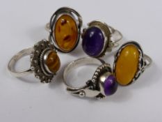 A Miscellaneous Collection of Silver and Silver Metal Rings including Tiger`s Eye, amber and two