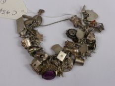 A Silver Chain Bracelet with 42 different Italian charms.