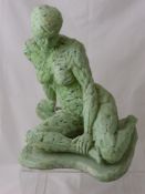 A green composite figure of a lady seated on the ground, approx. 33 cms. in height.