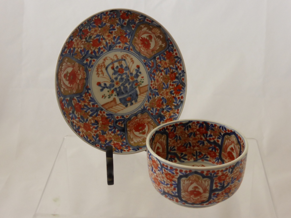 An antique Japanese Imari Bowl together with an antique Imari plate, both with character marks to