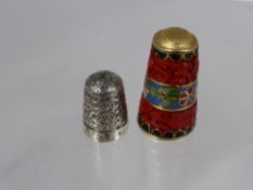 An Antique Chinese Red Lacquer and Cloisonné Sewing Thimble together with a solid silver Chester