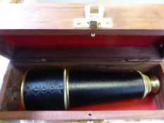 A Brass and Leather Telescope with four drawers, presented in a fruit wood box with a brass anchor