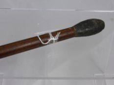 An antique Indian Cosh, the hard wood handled weapon having lead to the one end.