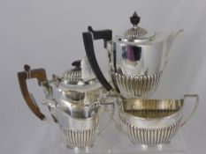 A Goldsmiths and Silversmiths silver plated tea service comprising teapot, milk jug, sugar bowl and