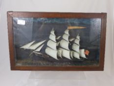 Victorian model of a ship in full sail, mounted in a glass frame, approx. 51 x 31 cms.