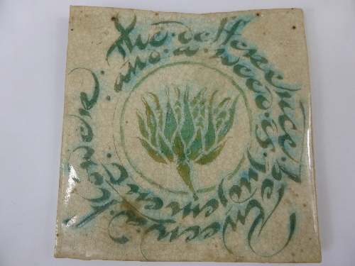 An Arts & Crafts Tile, the tile reads ` The difference between a flower and a weed is judgement`