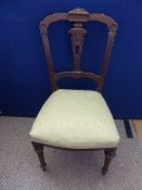 Set of five Edwardian dining chairs, the backs having ornate carved decoration with turned front