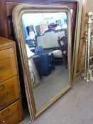 Large 19th century wall mirror set in a gilt frame decorated with beading, approx. 104 x 147 cms.