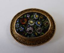 Italian Oval Micro Mosaic Brooch, depicting a floral bouquet, in a fancy 14k setting.