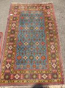 Middle Eastern Style Woollen Rug, with red border, approx 176 x 109 cms