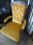 Victorian mahogany button back armchair having turned front legs and castors, the chair being