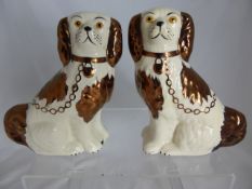 Pair of ceramic flat back figures of spaniels by Old Court Ware, Staffordshire, approx. 16 cms.