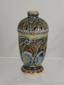 A Martin Bros Vase with foliate and winged design, inscribed to base R W Martin Southall dated