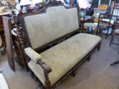 Late Victorian / Early Edwardian oak settle / bench, having beading to the edges of the upholstery,