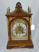 An Antique German Walnut Bracket Clock, the clock having brass dial with silvered chapter ring