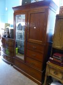 Victorian Gent`s mahogany Compactum having a bevelled glass mirrored door to the left, a cupboard