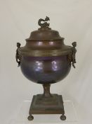 Copper Samovar having handles in the form of ""Minerva"" figures, the lid with a sea serpent finial
