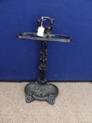 Vintage black cast iron umbrella / walking stick stand having ornate decoration to column, handle