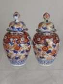 Two 19th Century Imari Porcelain Jars with domed cover, foliate design with gilt highlights.