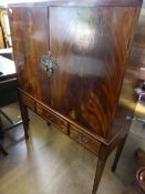 Victorian mahogany wine cabinet having a mirror backed cupboard to the top with a glass shelf to