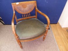 Small period oak armchair having fan shaped cane decoration to the back, with snake skin covering